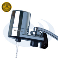Chrome water filter with water flowing out on a white background, featuring the instapure brand.
