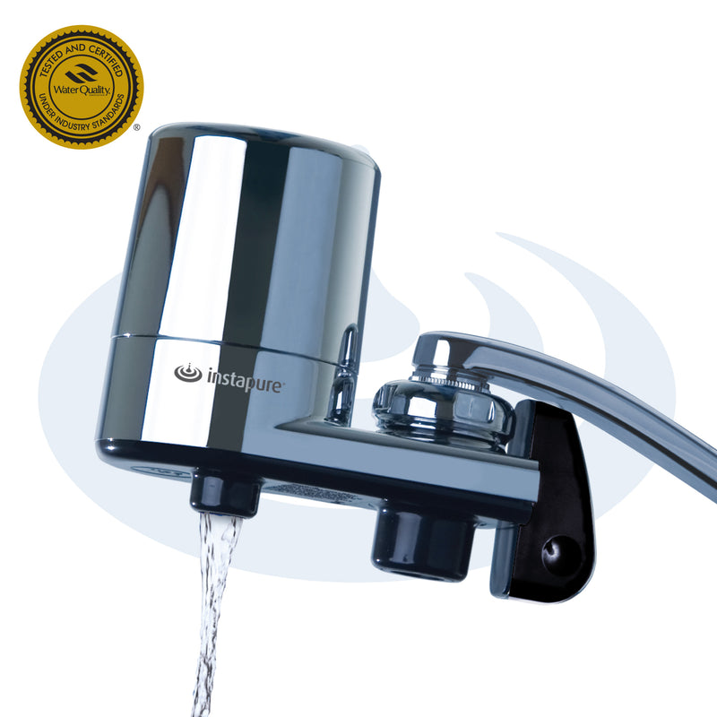 Chrome water filter with water flowing out on a white background, featuring the instapure brand.